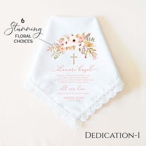 May include: White handkerchief with a floral design and a gold cross. The handkerchief has a lace trim and includes the text "elenore hazel" and other personalized text. The words "6 Stunning Floral Choices" are also present.