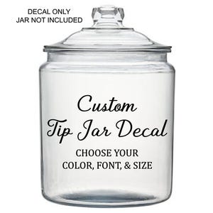 May include: A clear glass jar with a lid, featuring a custom "Tip Jar Decal". The text "CHOOSE YOUR COLOR, FONT, & SIZE" is below the main text. The words "DECAL ONLY JAR NOT INCLUDED" are at the top.
