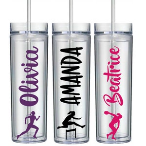 May include: Three clear plastic tumblers with straws. Each tumbler has a different name on it: Olivia, Amanda, and Beatrice. The names are in different colors and fonts. Each tumbler also has a silhouette of a woman running on it.