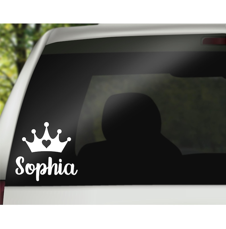 May include: White vinyl decal with a crown and the name Sophia. The crown has a small heart in the center.
