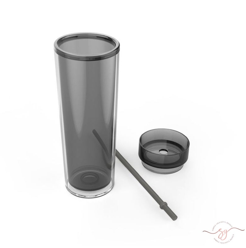 May include: A clear, gray tumbler with a lid and a gray straw. The tumbler is made of plastic and has a smooth finish.