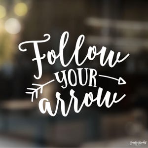 May include: White text on a blurred background reads "Follow your arrow" with an arrow pointing to the right.