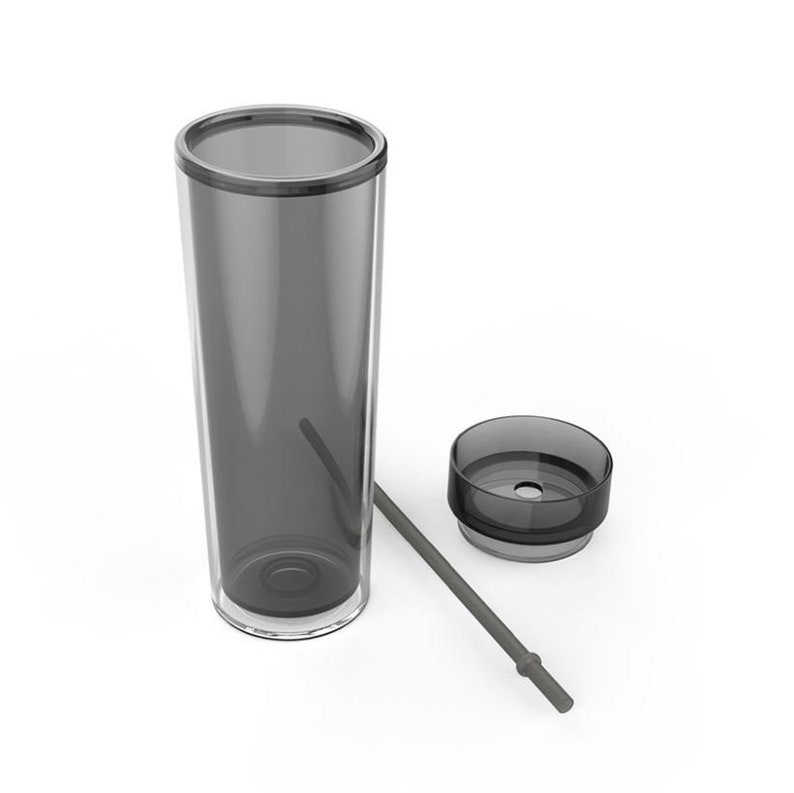 May include: A clear, gray tumbler with a lid and a gray straw. The tumbler is made of plastic and has a smooth finish.