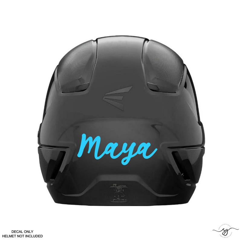 May include: A black baseball helmet with a blue cursive name "Maya" on the front.