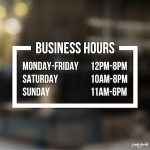 May include: White sign with black text listing business hours. Monday-Friday 12PM-8PM, Saturday 10AM-8PM, Sunday 11AM-6PM.