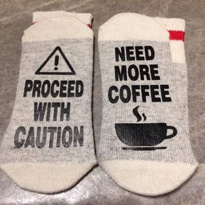 Proceed With Caution ... Need More Coffee (Word Socks - Funny Socks - Novelty Socks)