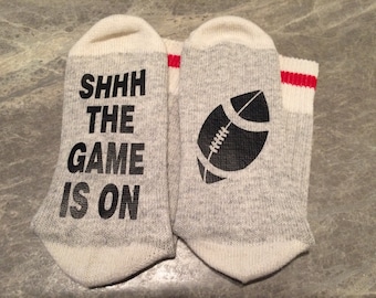 Shhh The Game Is On .... (Football Silhouette) (Word Socks - Funny Socks - Novelty Socks)