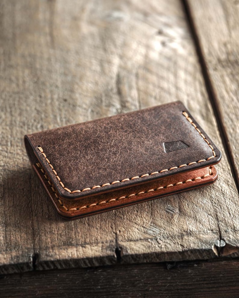 Minimalistic handmade leather bi-fold wallet for men. Color bark. Closed