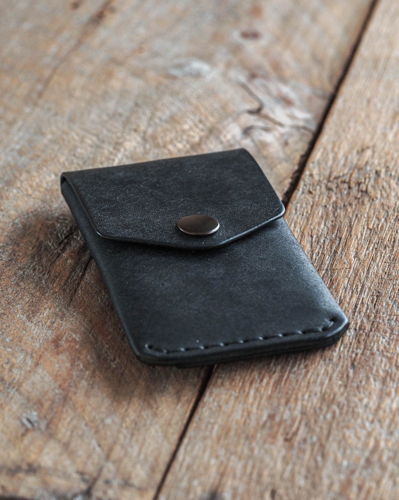 Black leather wallet handmade in Finland with vegetable tanned leather. A card holder or a coin pouch with button. Italian full grain leather. Handmade leather wallet for men. Gift for him. wallet for woman. gift for her