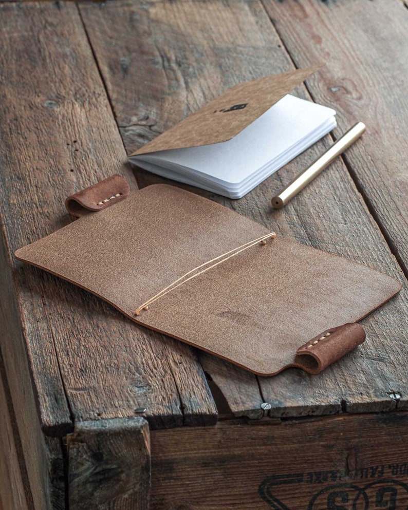 Handmade leather journal. Leather notebook cover. Leather sketchbook cover with a pen holder. Vegetable tanned leather from Italy. Handmade in Finland. open empty.