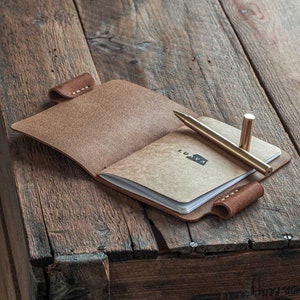 Handmade leather journal. Leather notebook cover. Leather sketchbook cover with a pen holder. Vegetable tanned leather from Italy. Handmade in Finland. open