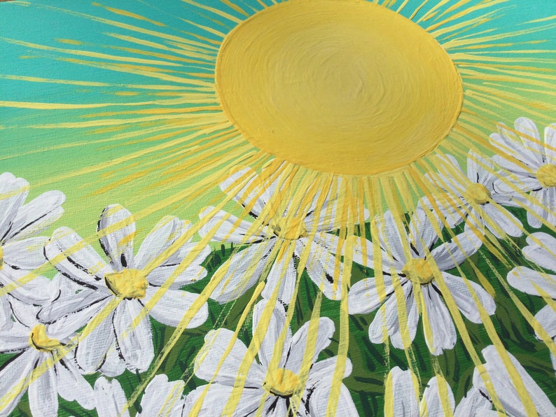 May include: A painting of a bright yellow sun with rays of light shining down on a field of white daisies with yellow centers. The background is a gradient of green and blue.