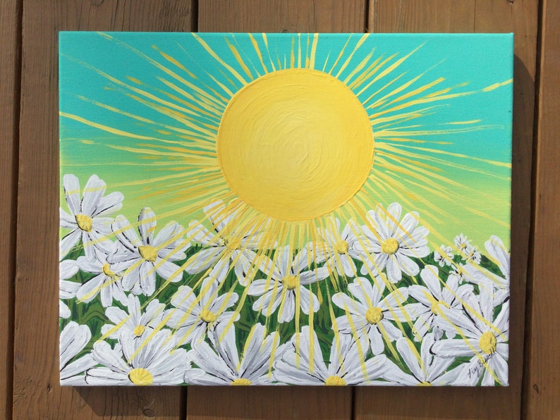 May include: A painting of a bright yellow sun with rays shining down on a field of white daisies. The background is a gradient of turquoise, green, and yellow.