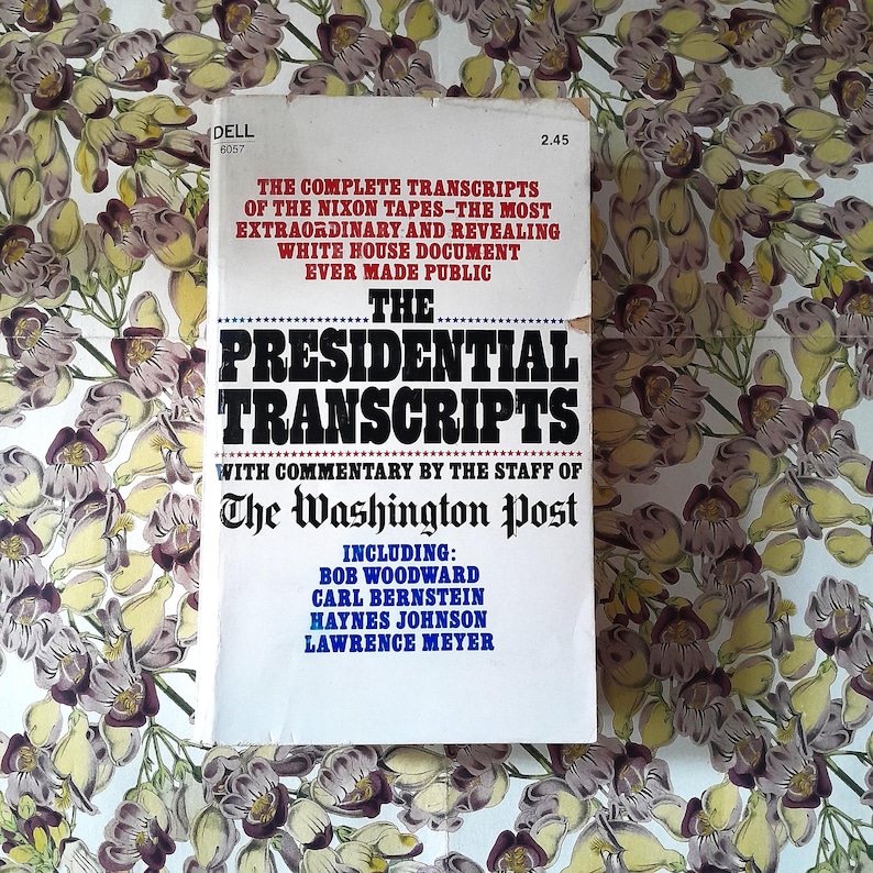 May include: A vintage paperback book titled "The Presidential Transcripts" with text in red and black. The book includes commentary by The Washington Post and features the names Bob Woodward, Carl Bernstein, Haynes Johnson, and Lawrence Meyer.