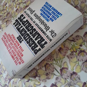 May include: A vintage paperback book titled "The Presidential Transcripts" by The Washington Post. The cover is white with black and red text. The book includes the complete transcripts of the Nixon tapes.