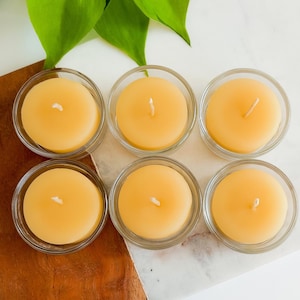 May include: A set of three ceramic mugs with a speckled, matte finish. The mugs are in shades of cream, light gray, and dark gray. Each mug has a simple, minimalist design, perfect for coffee or tea.