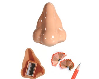 Pencil sharpener in the shape of a nose, fun and unusual stationery for school kit, funny fake nose prank, fun school supply