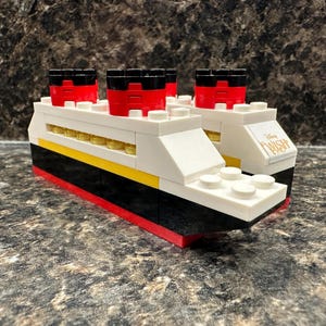 DCL LEGO® Ship Kit made from authentic, new bricks | Fish Extender (FE) gift w/bag. Customize w/ ship name, mouse ear keyring, and NavCard®!