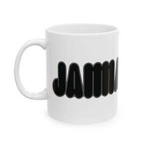 May include: White ceramic mug with the name "JAMMA" in large, black, bubble letters with a gray outline. The mug has a curved handle and a glossy finish, suitable for hot or cold beverages.