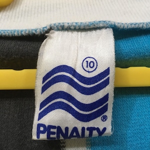May include: A white tag with blue waves and the word "PENALTY" in blue lettering. The tag also has a circle with the number "10" inside.