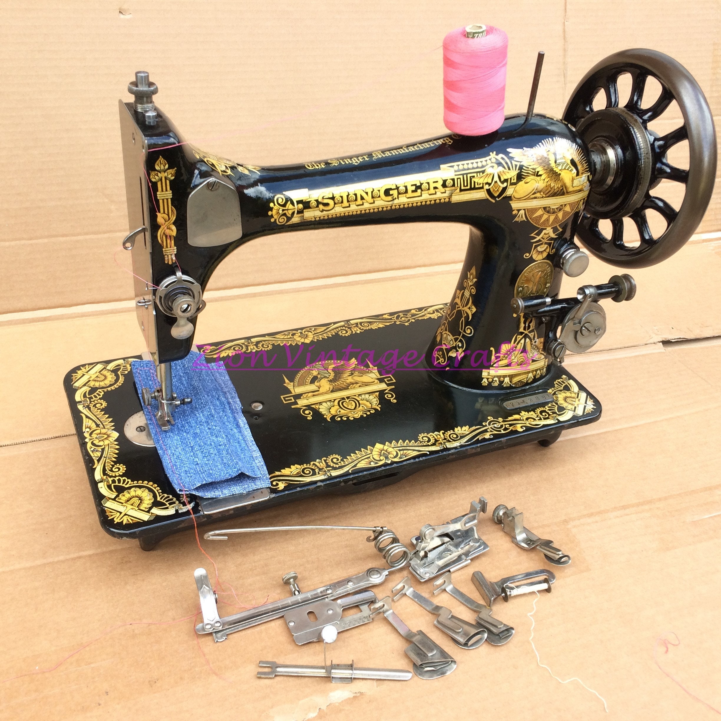 Vintage Singer sewing machine threaded with spool of white thread on white  Stock Photo - Alamy