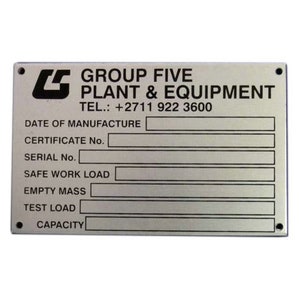May include: Silver metal nameplate with black text. The text reads "GROUP FIVE PLANT & EQUIPMENT TEL.: +2711 922 3600 DATE OF MANUFACTURE CERTIFICATE No. SERIAL No. SAFE WORK LOAD EMPTY MASS TEST LOAD CAPACITY".