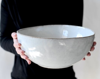 White, light gray ceramic bowl .