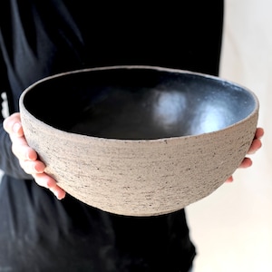 Rough gray clay and black ceramic bowl