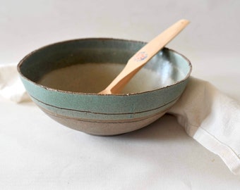 Green ceramic salad bowl with rough clay