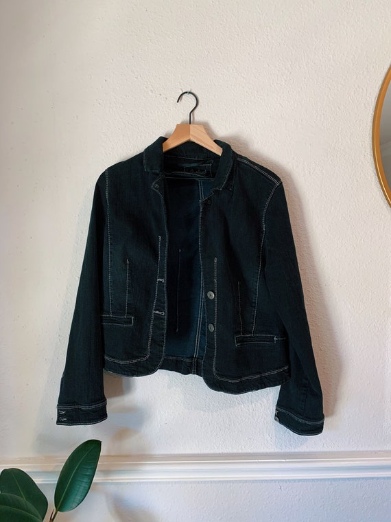 black jacket with white stitching