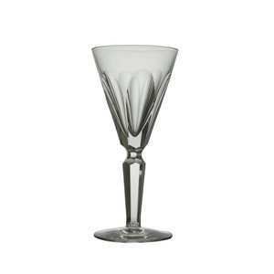May include: A clear glass wine glass with a cut crystal design. The glass has a tall, slender stem and a wide, round bowl.