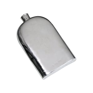 May include: A polished silver flask with a rounded top and a small, cylindrical spout. The rectangular body has a slight curve, and the surface reflects light. The flask is likely made of metal and is designed to hold liquids.