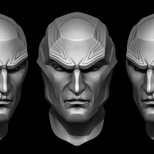 May include: A 3D model of a human head with a detailed, futuristic helmet design. The helmet has a geometric pattern and a raised, circular design on the forehead.