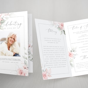 May include: A funeral program with a floral design featuring pink roses and green leaves. The program includes the name Judith Patterson, dates of birth and death, and an obituary. The order of service is also listed.