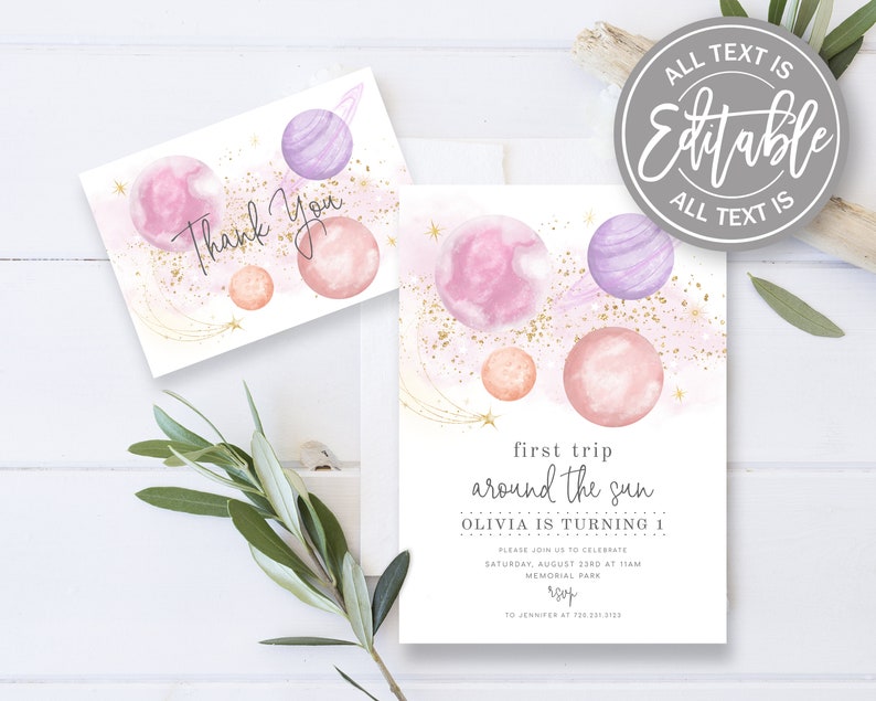 May include: Pink and purple watercolour planets with gold glitter and stars on a white background. The text "first trip around the sun Olivia is turning 1" is printed on the invitation.