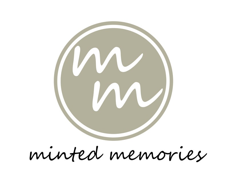 May include: A logo featuring a circular design with a light gray background and a white border. Inside the circle are two stylized white lowercase "m" letters. Below the circle, the words "minted memories" are written in a cursive font.