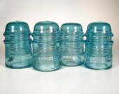 Set of 4 old AMERICAN TELEPHONE TELEGRAPH insulators, cd 121 insulators, Light Aqua glass insulators, old Telephone Toll Line insulators
