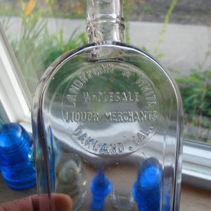 old LANDREGAN & WHITE Oakland California liquor flask, Wild West, Wholesale Liquor Merchants, Western Whiskey, Coffin flask