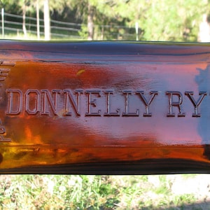 Quart old DONNELLY RYE whiskey flask, Western Whiskey bottle, Pre Prohibition, SACRAMENTO California, amber quart liquor bottle