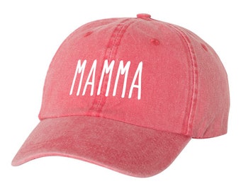 May include: A red baseball cap with the word "MAMMA" embroidered in white on the front.