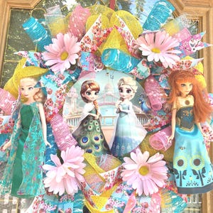 Detailed view of the 8-inch depth and layered ribbon textures of a Disney doll wreath, highlighting the intricate floral accents and doll placement