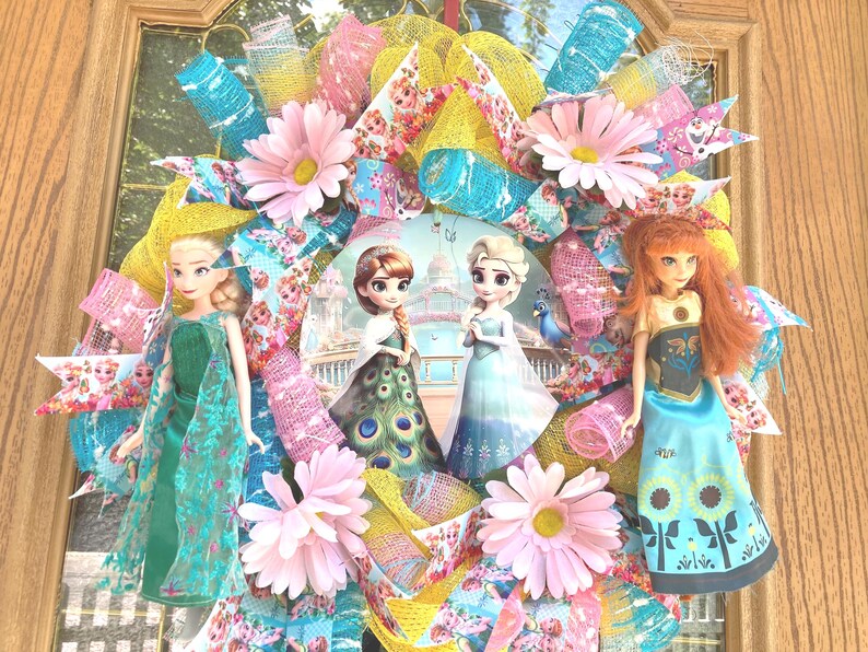 Detailed view of the 8-inch depth and layered ribbon textures of a Disney doll wreath, highlighting the intricate floral accents and doll placement