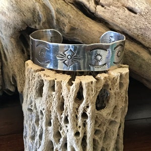 A sterling silver cuff bracelet. Made with 15 ga. silver. Handmade. Hand hammered. Made in the USA.