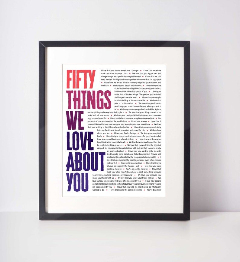May include: Framed art print with the text "FIFTY THINGS WE LOVE ABOUT YOU" in a colorful, gradient design. The print includes a list of loving sentiments in a white font against a dark background.