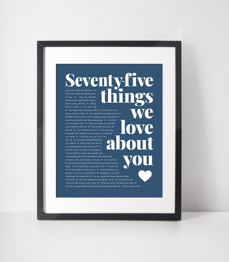 May include: A blue and white printable poster with the text "Seventy-five things we love about you" and a heart at the bottom. The text is in a bold, sans-serif font.