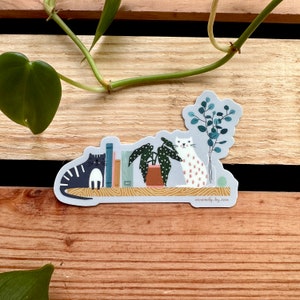 Cats, Books, and Plants on a Shelf Sticker