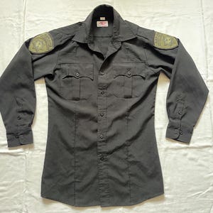 Abrams Protection group private security guard black uniform button shirt