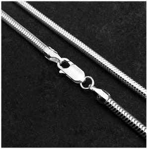 May include: A silver snake chain necklace with a lobster clasp.