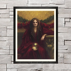 May include: A painting of a woman in a red robe, holding a golden orb in her hands. She is seated on a throne with a golden background. The painting is framed in black.