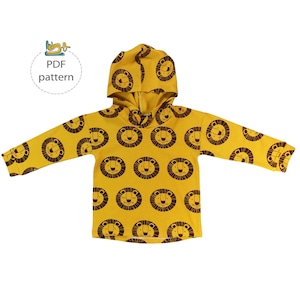 May include: A yellow hooded sweatshirt with a lion print. The sweatshirt has a PDF pattern label.